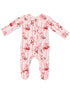Pink infant onesie decorated with Santa and bow patterns, featuring long sleeves and footed design.
