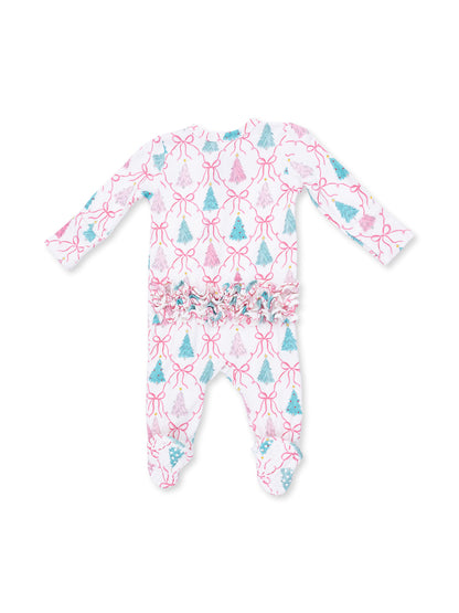 White baby onesie with colorful tree and ribbon patterns, featuring ruffled trim at the waist.