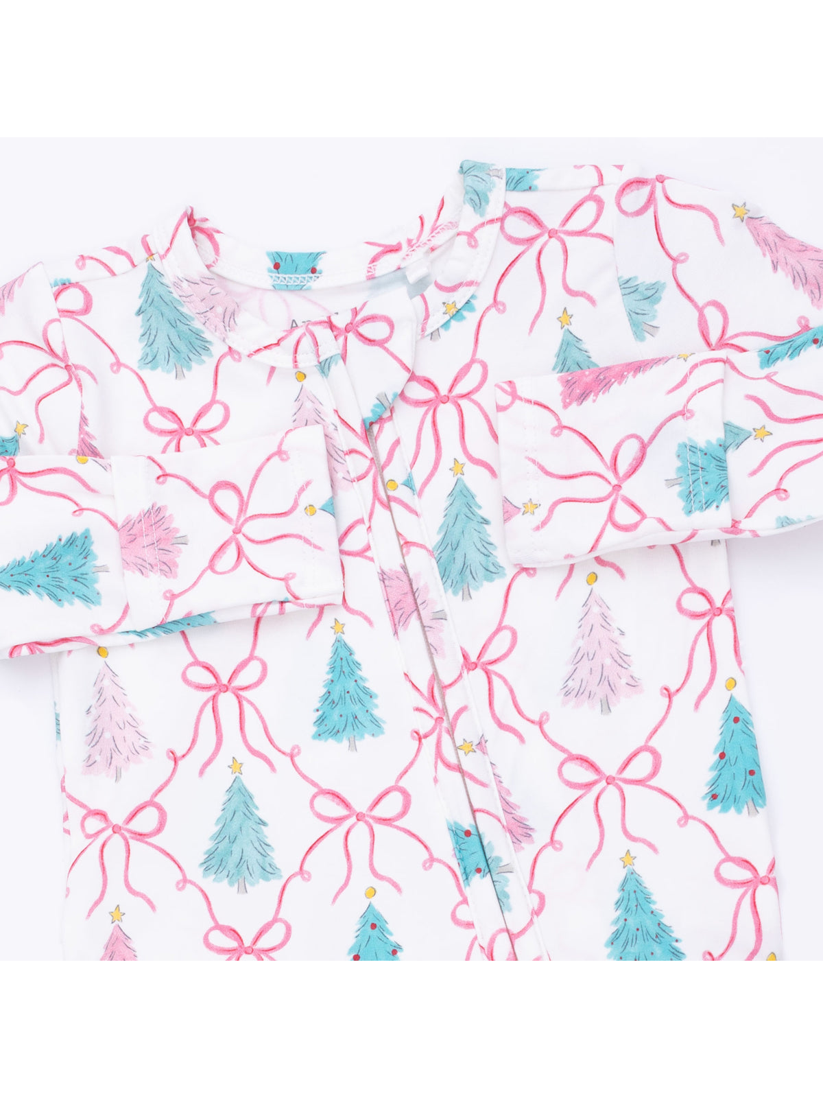 White fabric featuring colorful Christmas trees and pink bows in a playful, festive design.