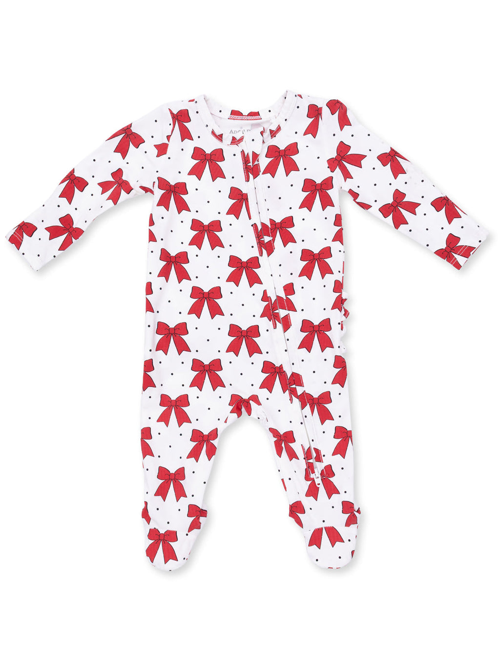 White baby onesie with red bows and black polka dots, featuring long sleeves and a front zipper.
