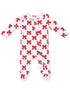 White baby onesie with red bows and black polka dots, featuring long sleeves and a front zipper.