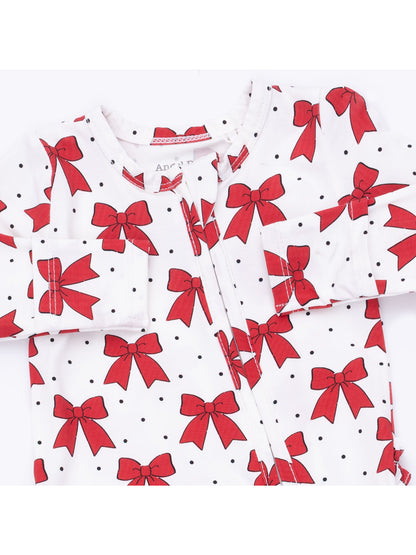 Red bow print onesie with black polka dots on a white background, featuring a front zip closure.