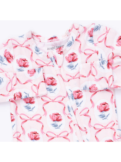 Floral baby outfit featuring pink roses and bows on a light background, labeled "Angel Dear."