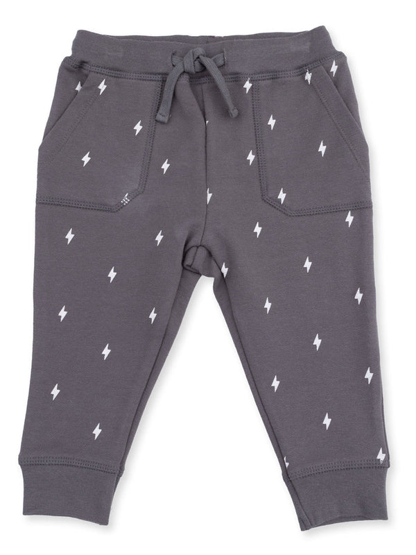 Gray sweatpants with white lightning bolt patterns and a drawstring waistband, featuring side pockets.