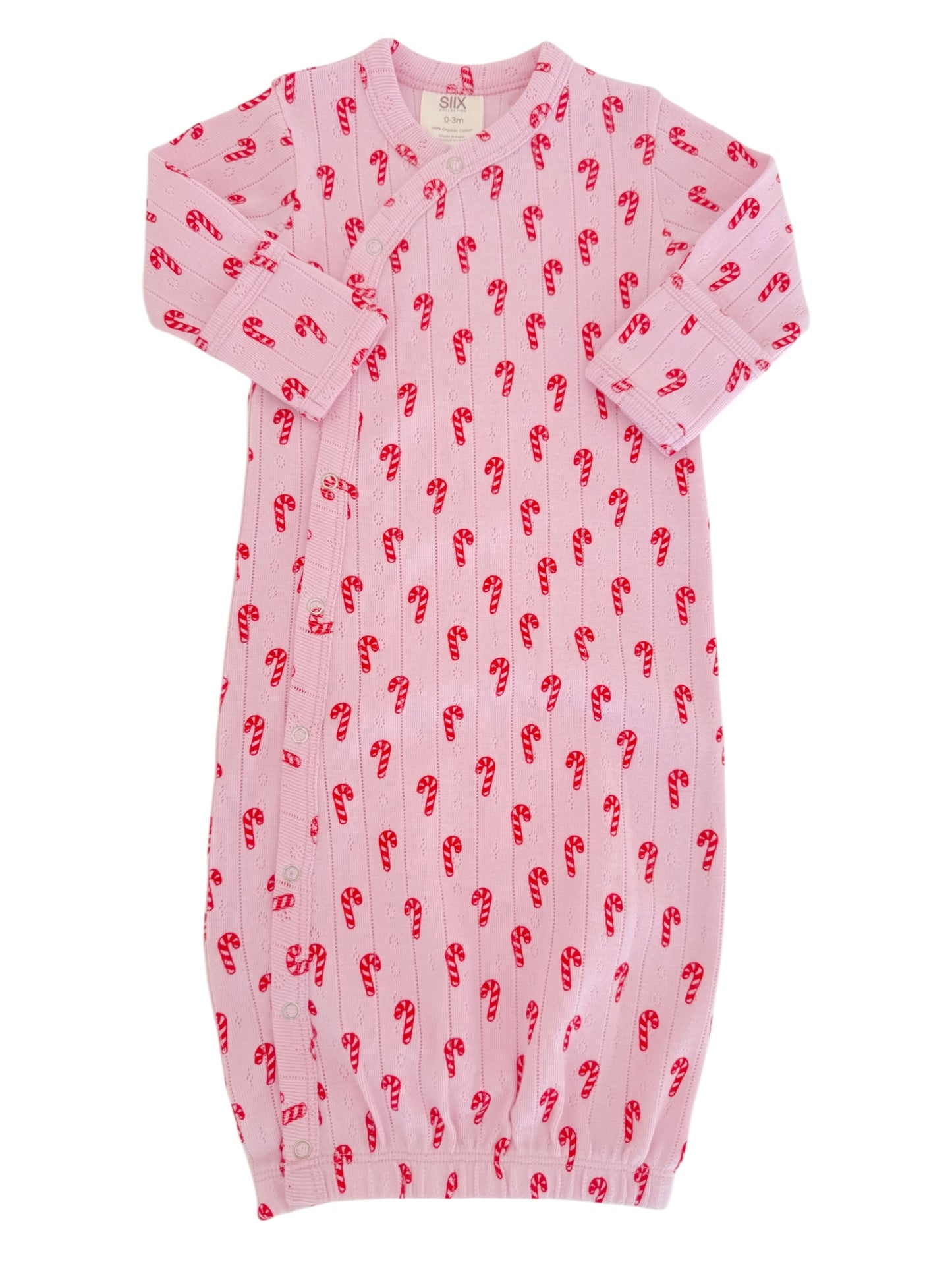 Pink baby gown with red candy cane pattern, featuring long sleeves and elastic bottom for easy dressing.