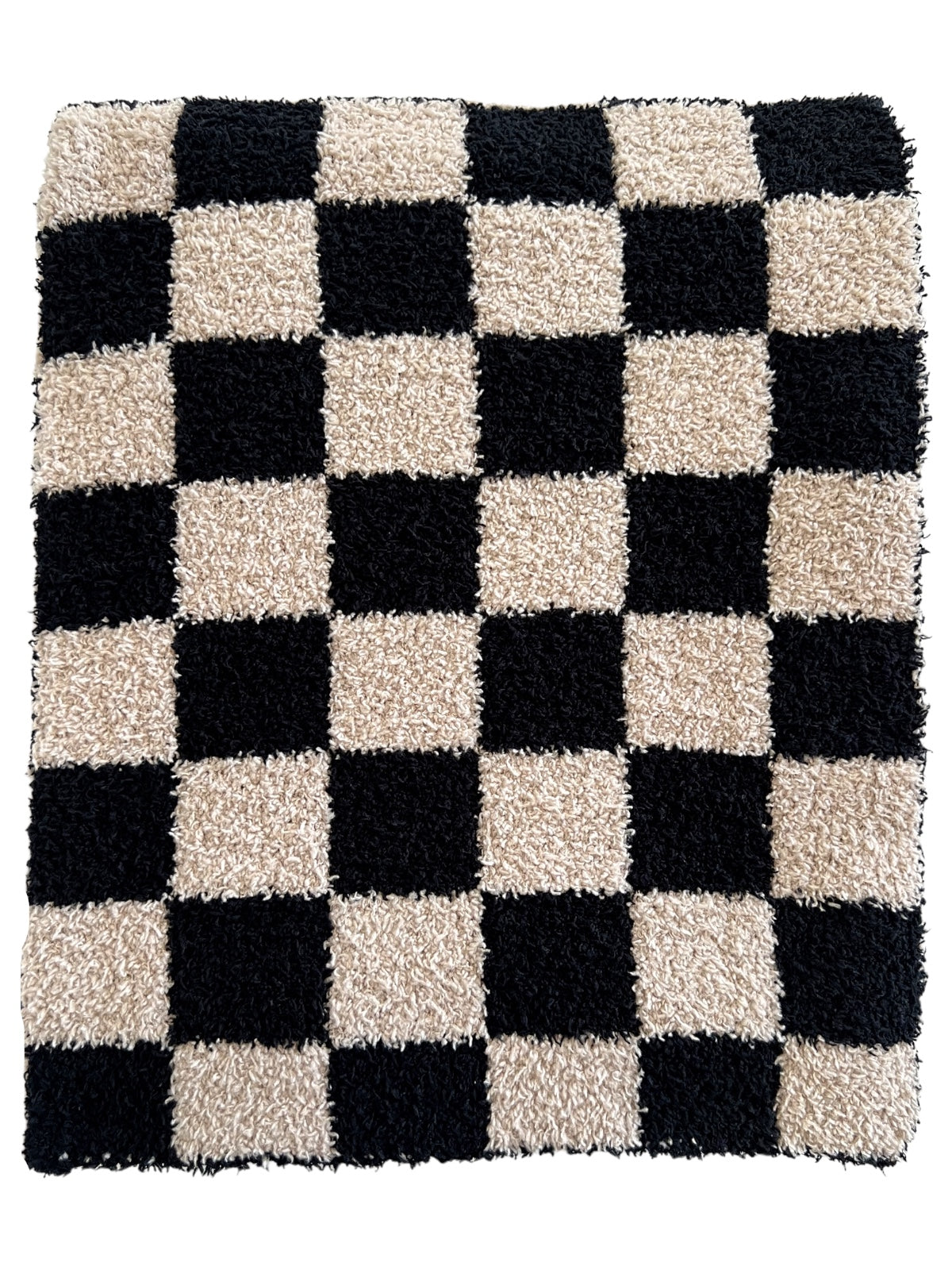 Black and beige shaggy rug with a large checkerboard pattern.