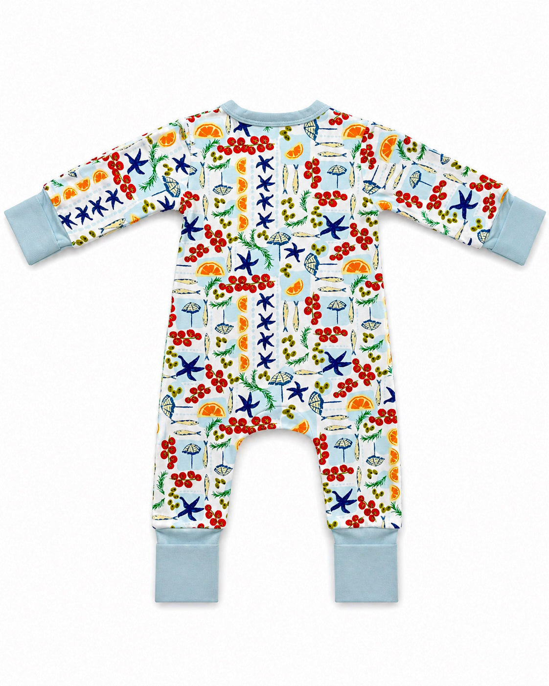 Colorful children's onesie with fruit and sea-themed patterns, visible sleeves and ankle cuffs.