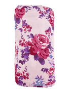 Floral-patterned fabric roll featuring pink roses and purple accents on a light background.