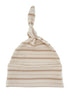 Cream and beige striped baby hat with a knot on top, made from soft fabric.