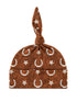 Brown hat with star and horseshoe patterns, featuring a knotted top for a stylish look.