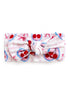 Light pink headband with a cherry print and a knotted design at the front. Perfect for accessorizing outfits.