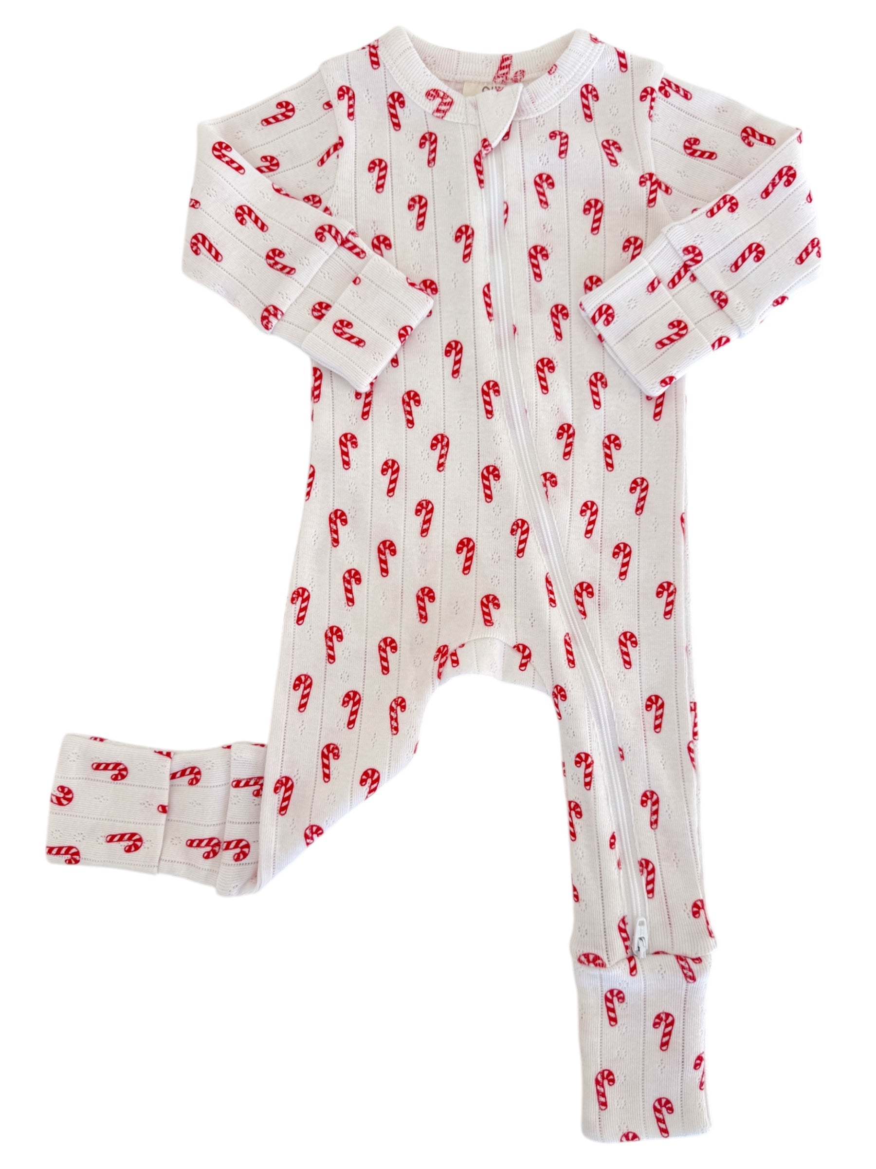 White one-piece pajamas with red candy cane pattern, featuring a front zipper and long sleeves.
