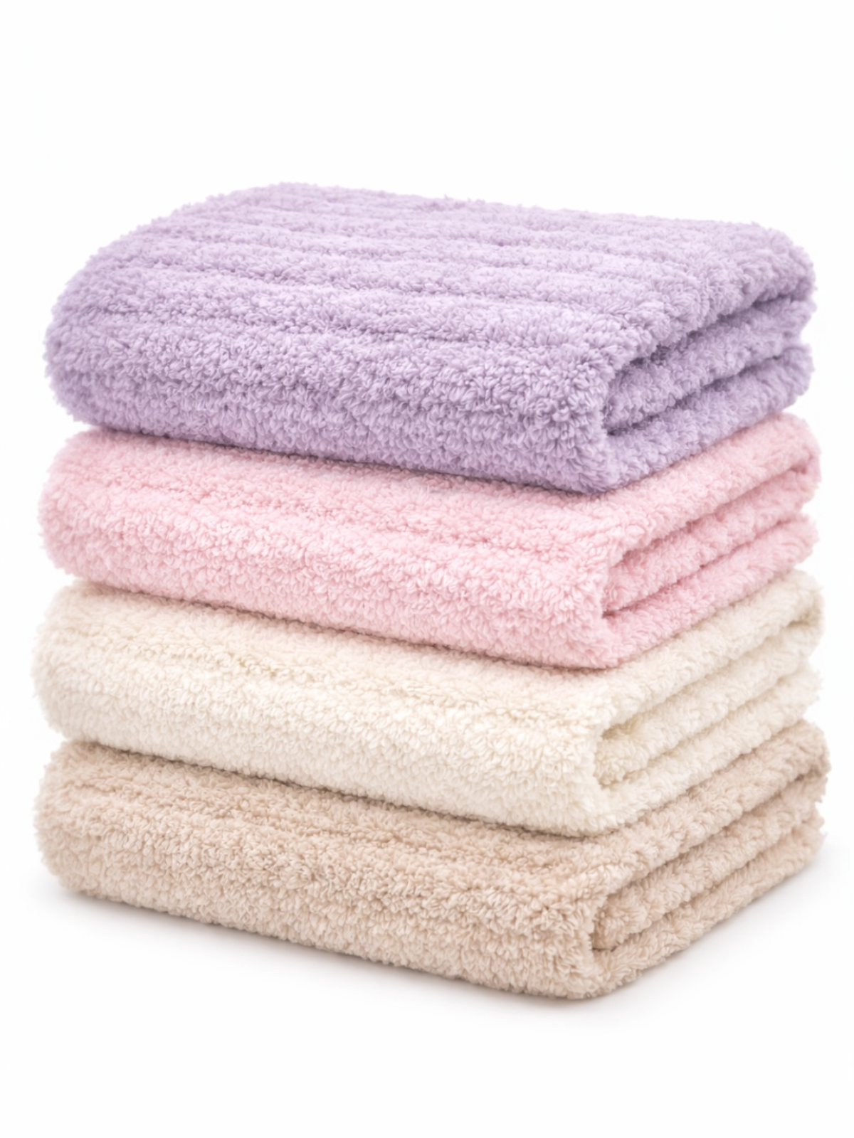 Soft, folded towels in pastel colors: lavender, pink, cream, and beige stacked neatly.
