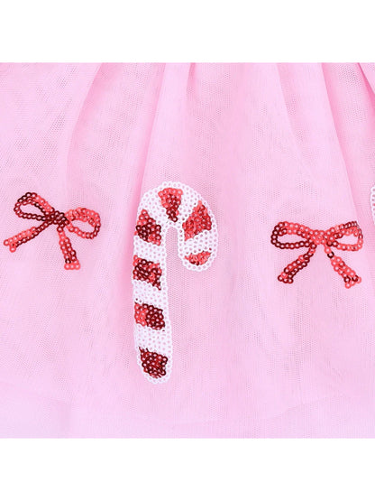 Pink tulle fabric featuring sequin candy canes and bows for a festive design.