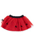 Red tulle skirt with black waistband and decorative bows, featuring gold polka dots throughout.