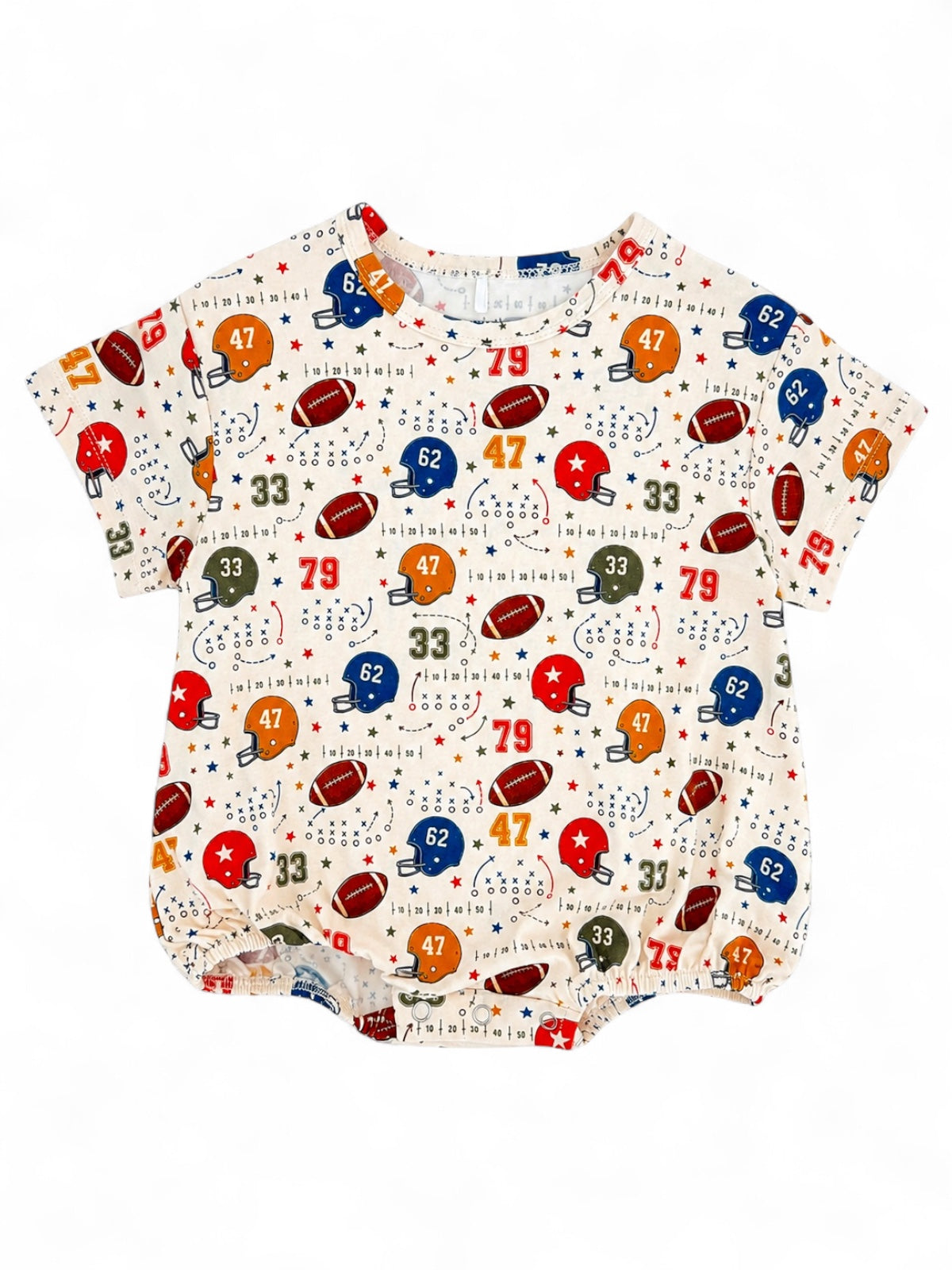 Cream shirt with colorful football and star patterns, featuring numbers and helmets for a playful sports theme.
