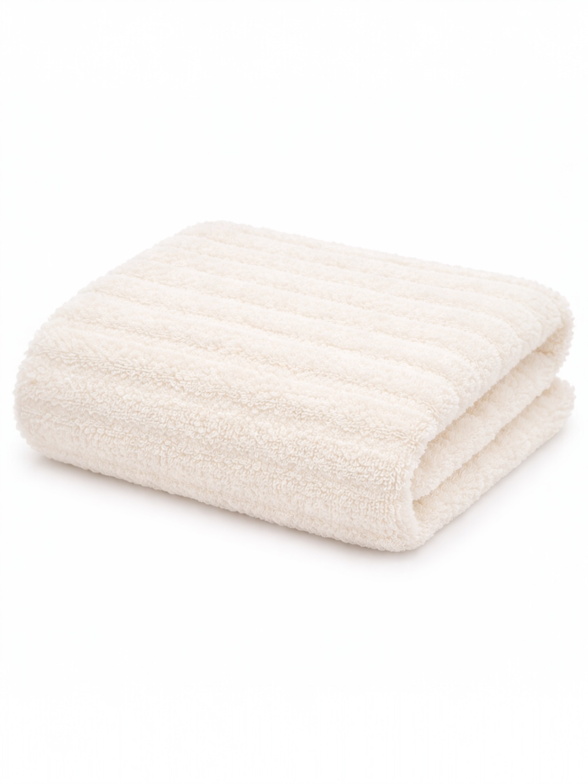 Folded cream-colored towel with a textured surface on a white background.