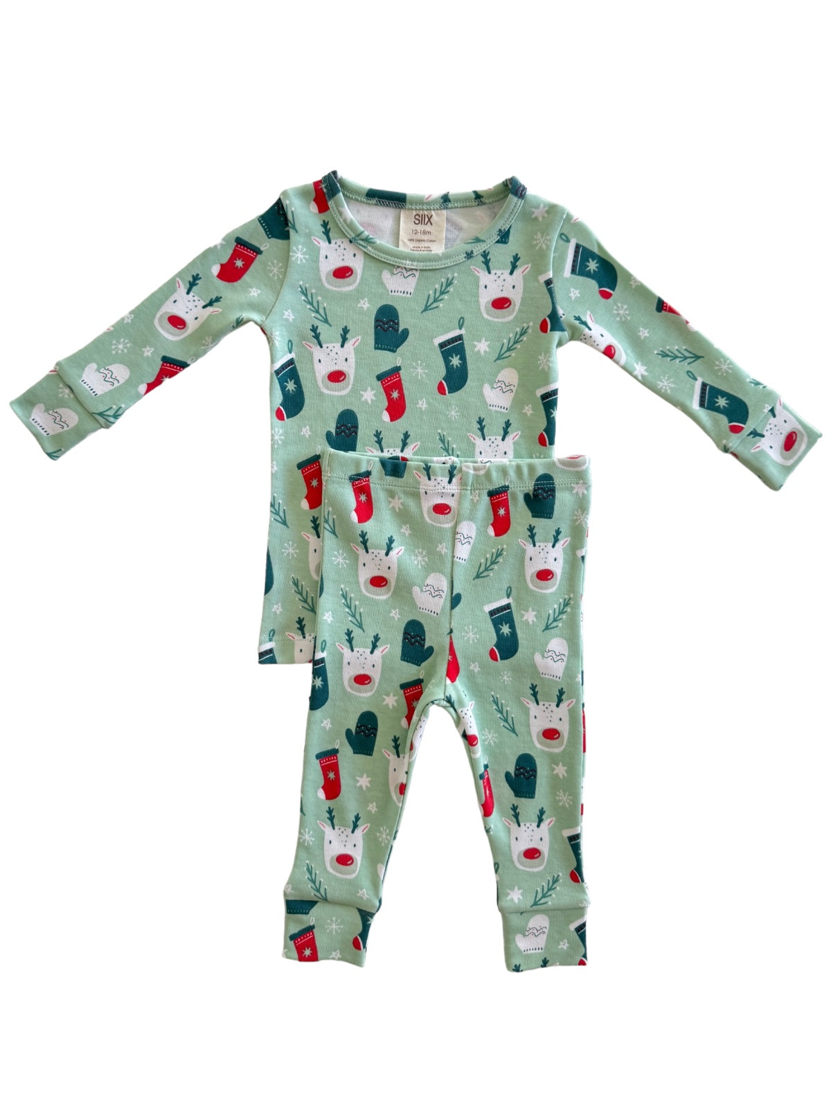Green pajama set with festive reindeer and stockings design on top and matching pants.