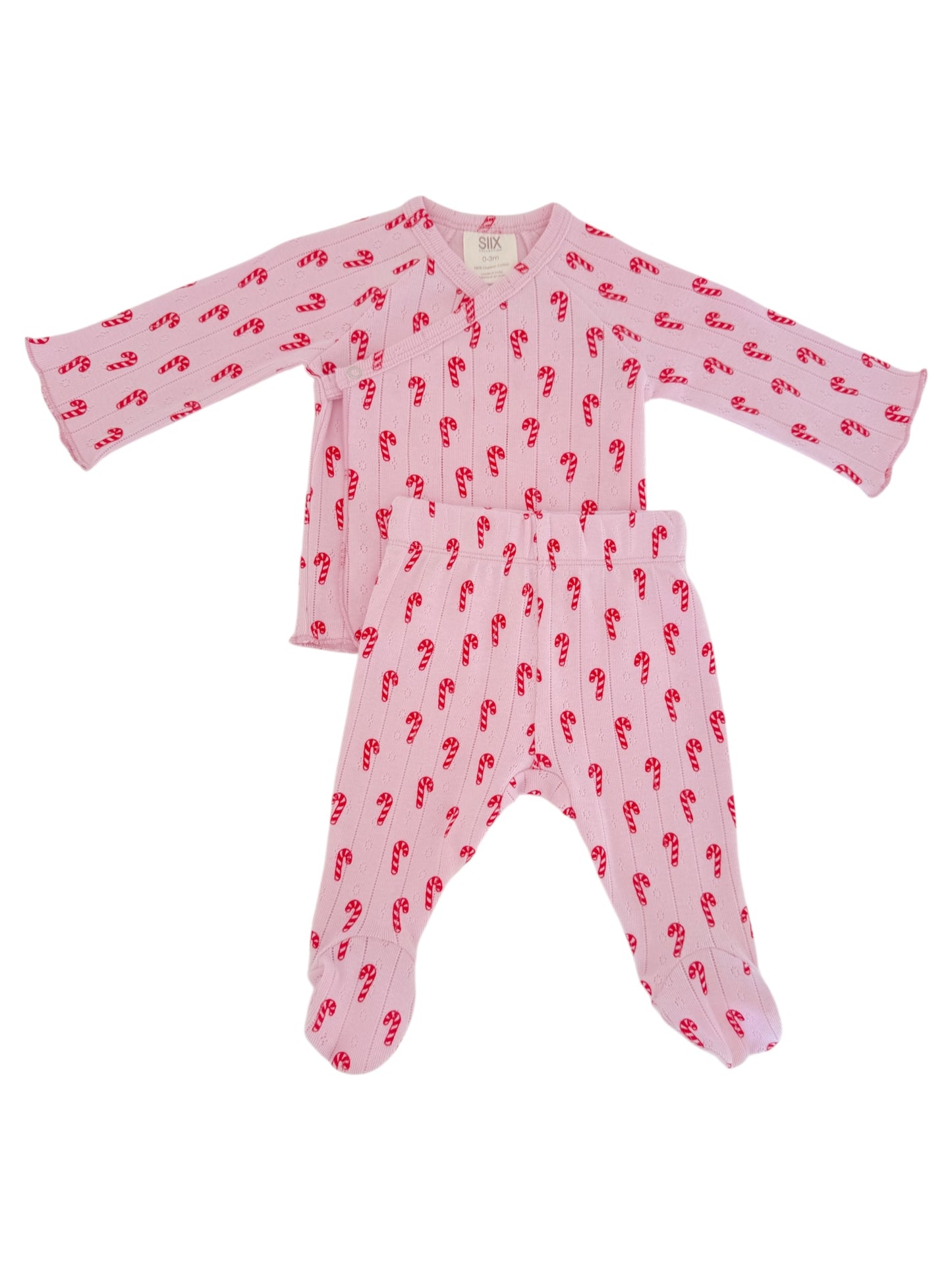 Baby pajama set with long sleeves and pants, featuring a pink color and red candy cane pattern.