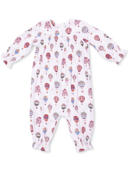 White baby onesie featuring colorful hot air balloon patterns. Long sleeves with elastic cuffs.