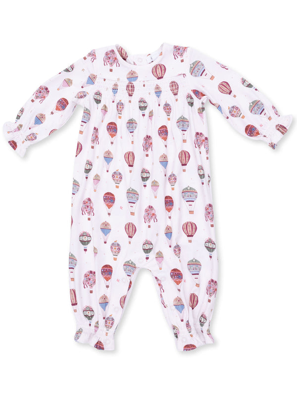 White baby onesie featuring colorful hot air balloon patterns. Long sleeves with elastic cuffs.