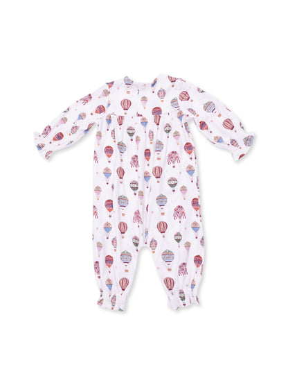 White baby onesie with colorful hot air balloon print and ruffled sleeves.