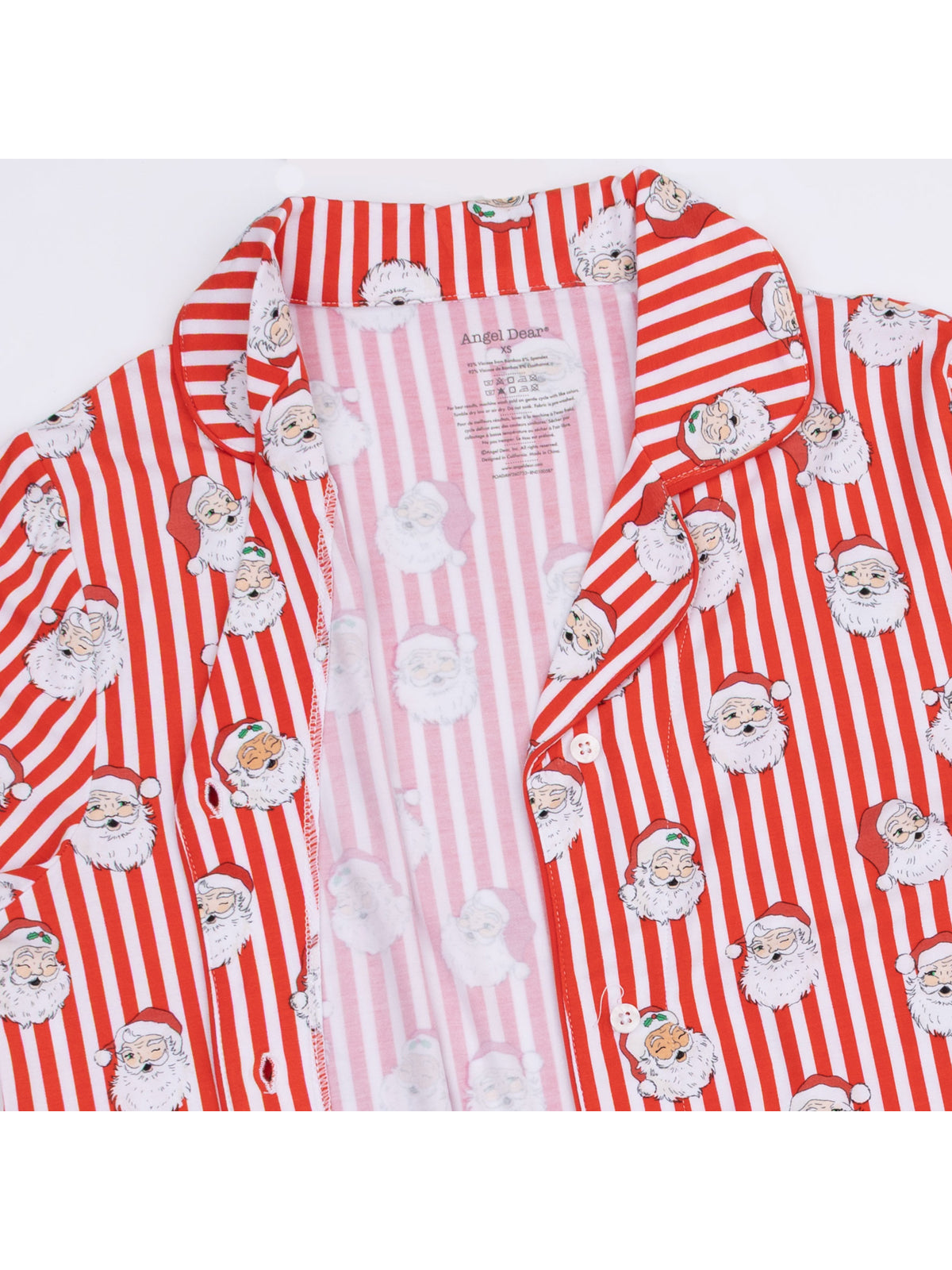 Red striped pajama shirt featuring playful Santa Claus illustrations on the fabric.