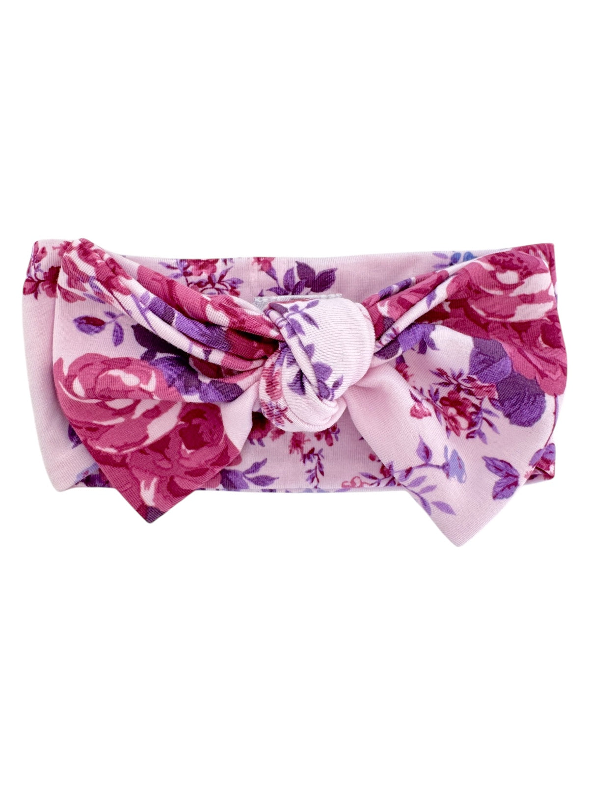Floral pink headband with a large bow, featuring roses in shades of pink and purple.
