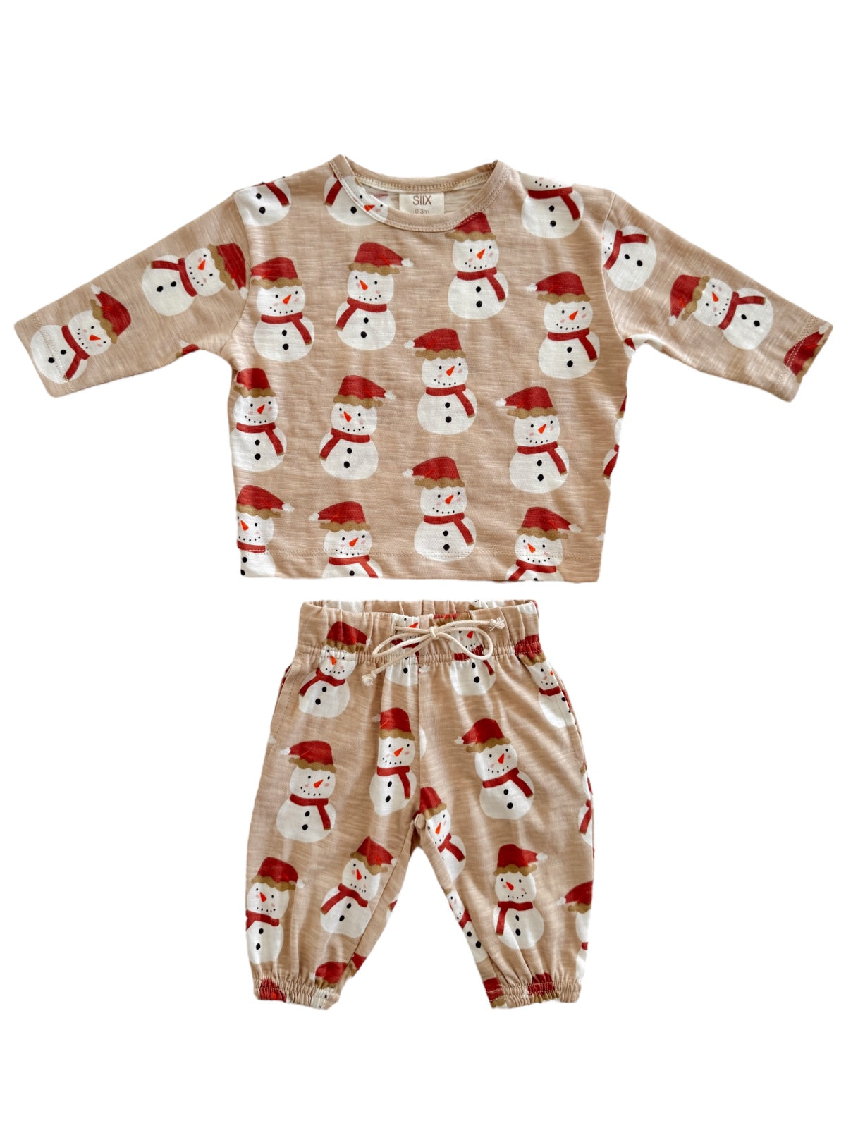 Children's winter outfit featuring a snowman-patterned top and matching pants in soft beige fabric.