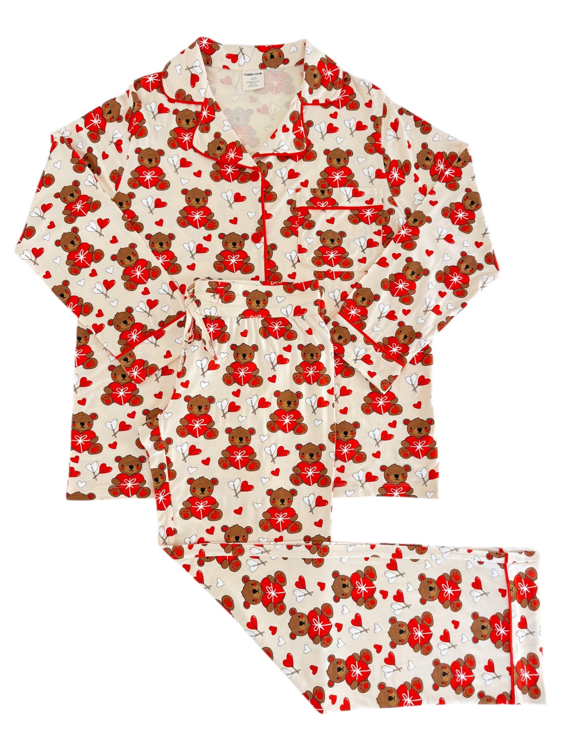 Pajama set featuring a bear and heart pattern in red and beige colors, ideal for cozy sleepwear.