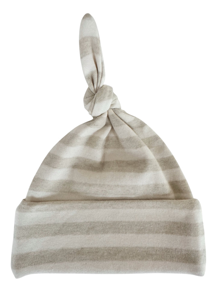 Striped baby beanie in soft neutral tones with a knot at the top.