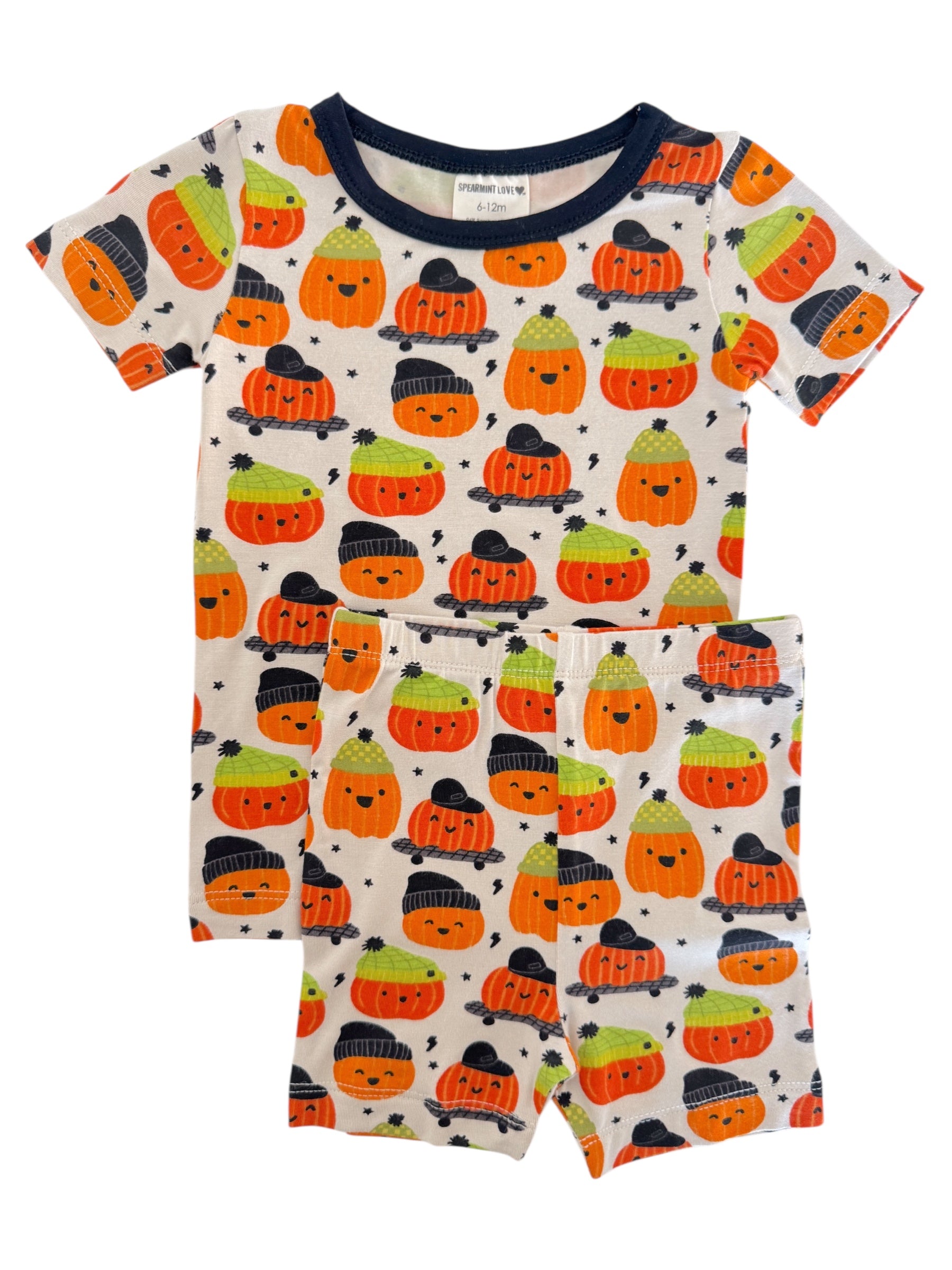 Toddler Halloween pajamas with colorful pumpkin prints, short sleeves, and shorts design. Cute and festive for kids.