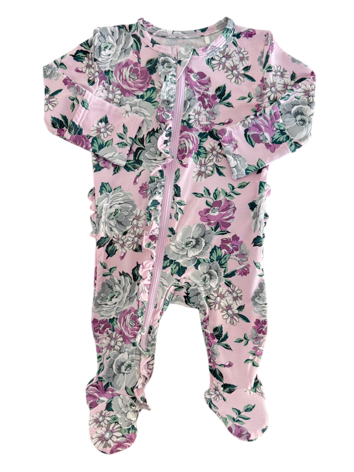 Floral-patterned pink baby onesie with a front zipper and ruffles along the sides.