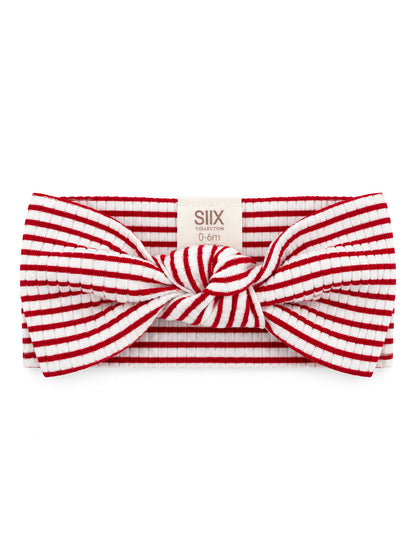 Red and white striped baby headband with a large bow, suitable for infants 0-6 months.