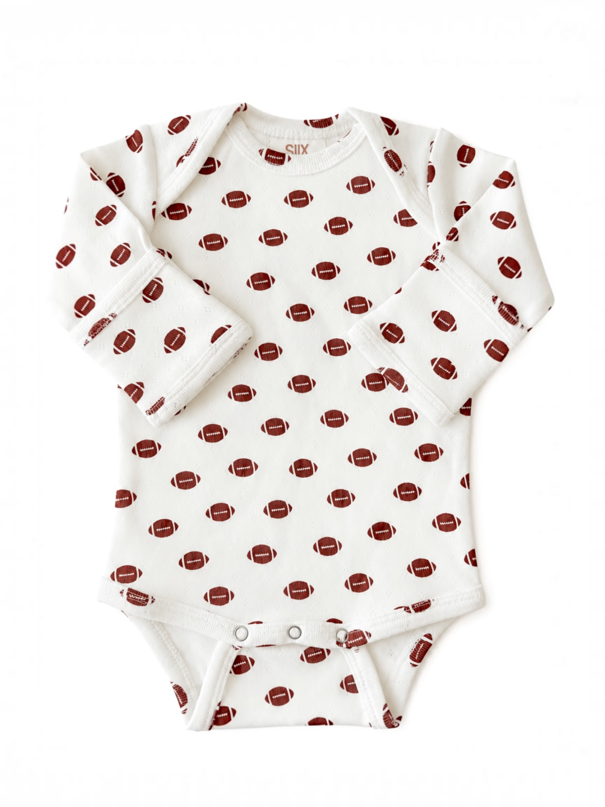 White baby onesie with football print pattern in brown and red, long sleeves and snap button closure.
