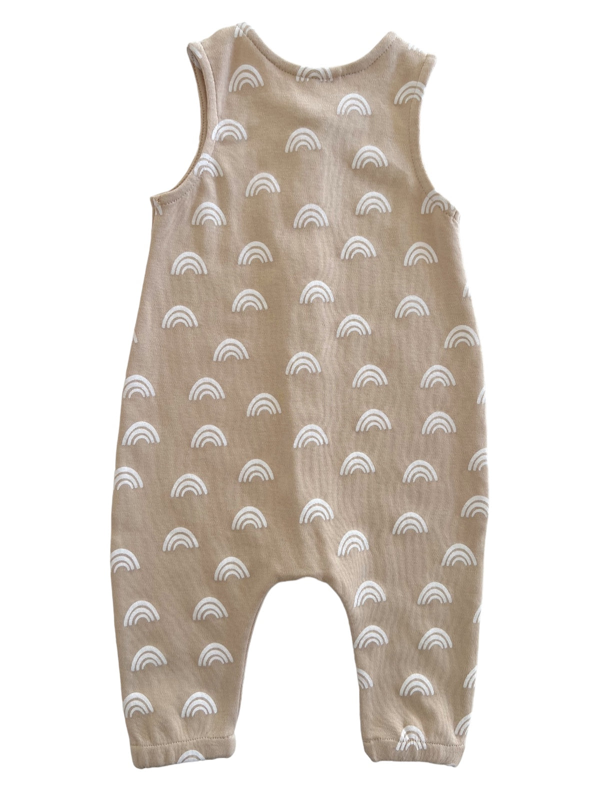 Beige baby romper featuring white rainbow patterns, sleeveless design, and relaxed fit. Ideal for comfortable wear.