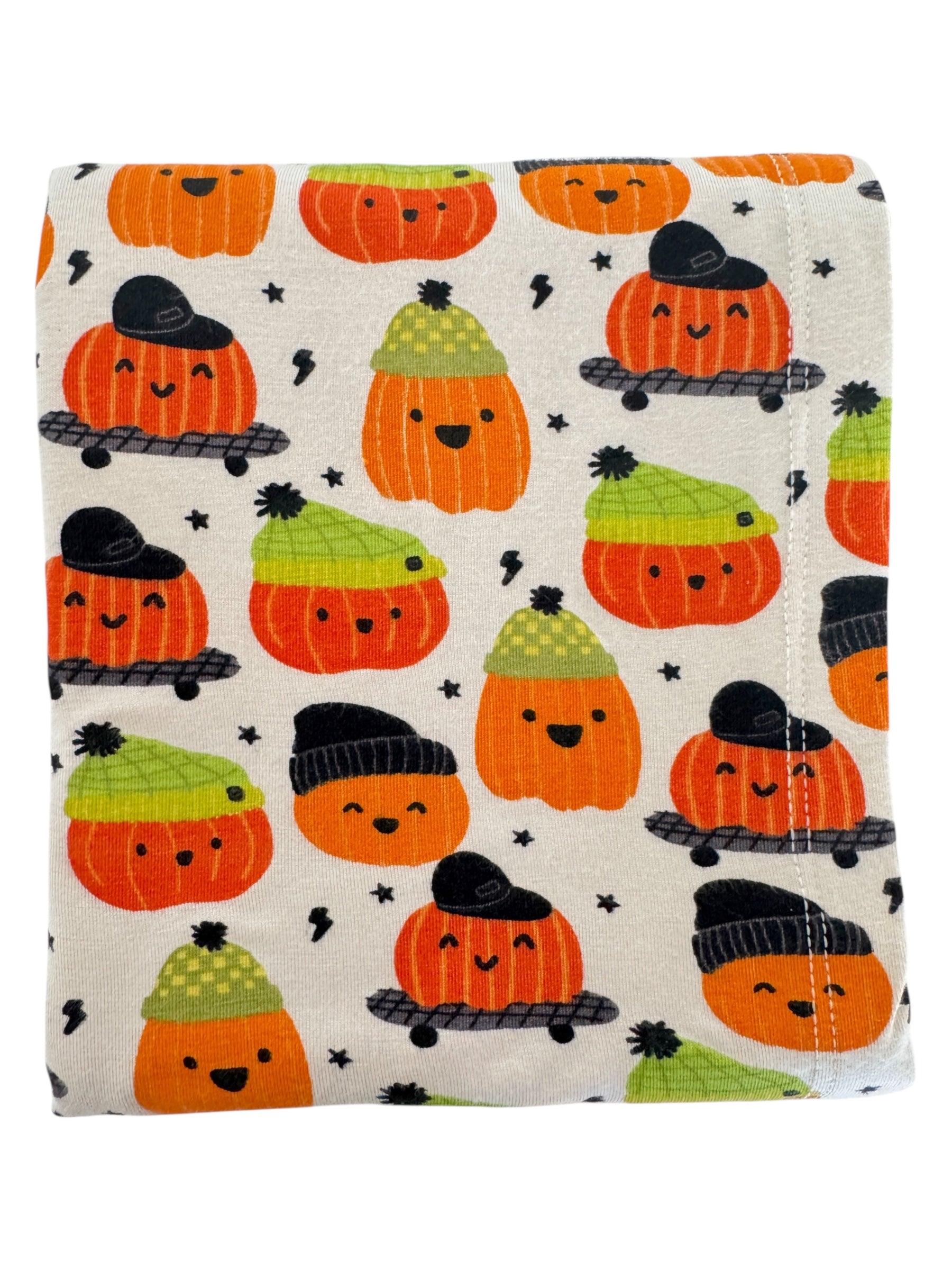 Colorful fabric featuring cute, smiling pumpkins wearing hats against a light background. Perfect for Halloween decor.