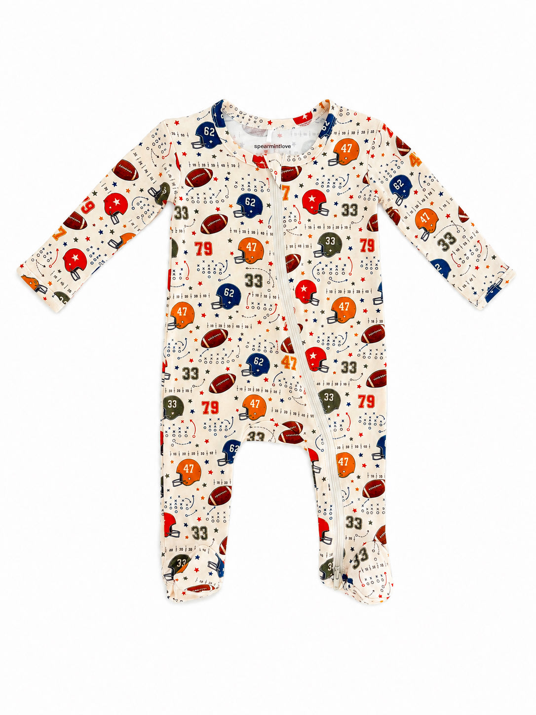 Infant pajama suit with a playful football and helmet pattern in various colors on a light background.