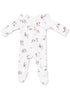 White baby onesie with a cute dog print and floral accents, featuring a front zipper and long sleeves.