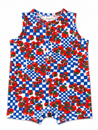 Colorful baby romper featuring red tomatoes on a blue and white checkered background.