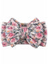 Floral stretchy hair bow featuring a mix of pink and purple flowers on a soft background.