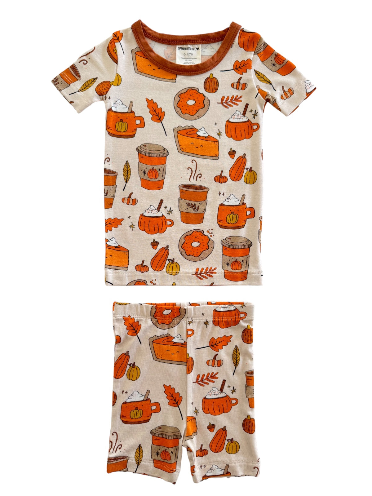 Toddler pajama set with autumn-themed prints, featuring pumpkins, leaves, and cozy drinks. Ideal for fall sleepwear.
