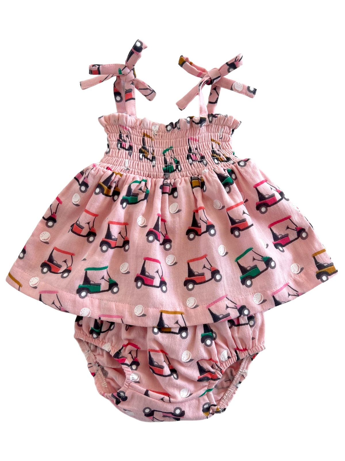 Pink baby dress with golf cart print, featuring adjustable straps and matching bloomer bottoms.