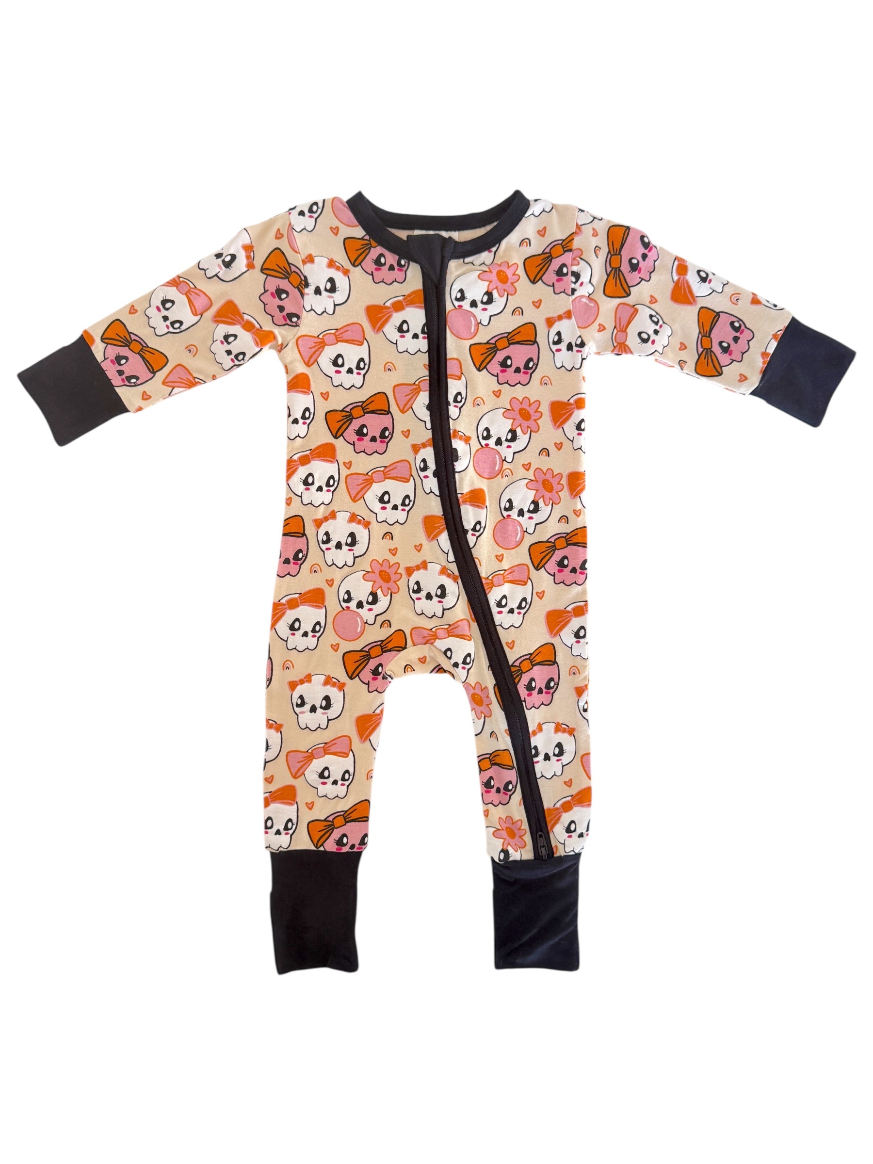 Colorful infant onesie featuring playful skulls and bows on a light background, with zip closure and long sleeves.