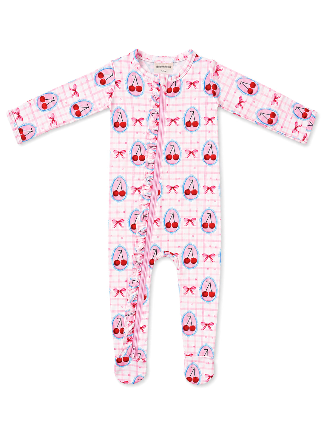 Pink onesie covered in cherry and bow patterns, featuring a front zipper and ruffled detailing.