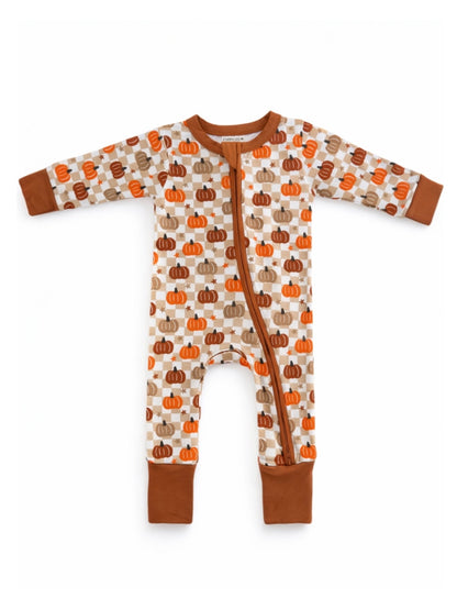 Infant zip-up romper with colorful pumpkin print on a cream background and brown accents.