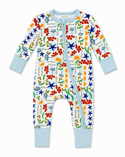 Colorful infant onesie with a playful nature-themed print, featuring starfish, umbrellas, and fruits.