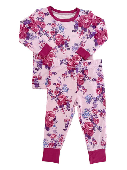 Floral children's pajama set featuring a long-sleeve top and matching pants in pink and purple hues.