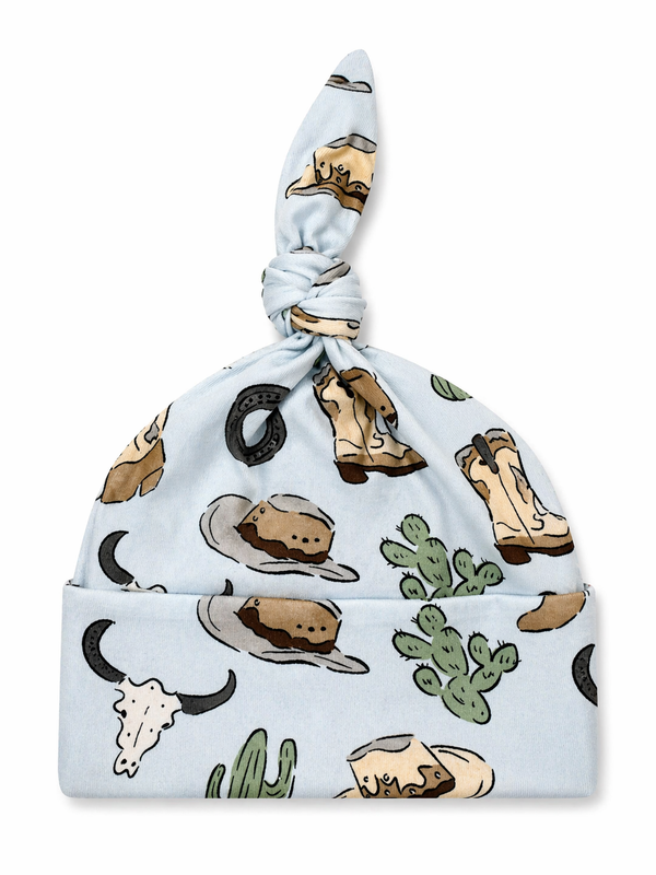 Blue baby hat adorned with cowboy-themed patterns, including hats, boots, cacti, and horseshoes.