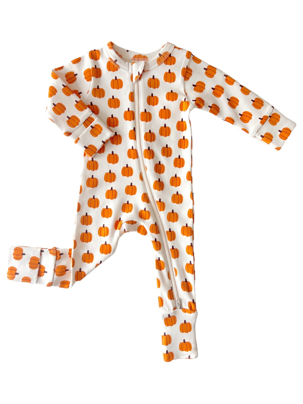 Infant one-piece pajamas with an orange pumpkin pattern on a white background, featuring a front zipper and footed legs.